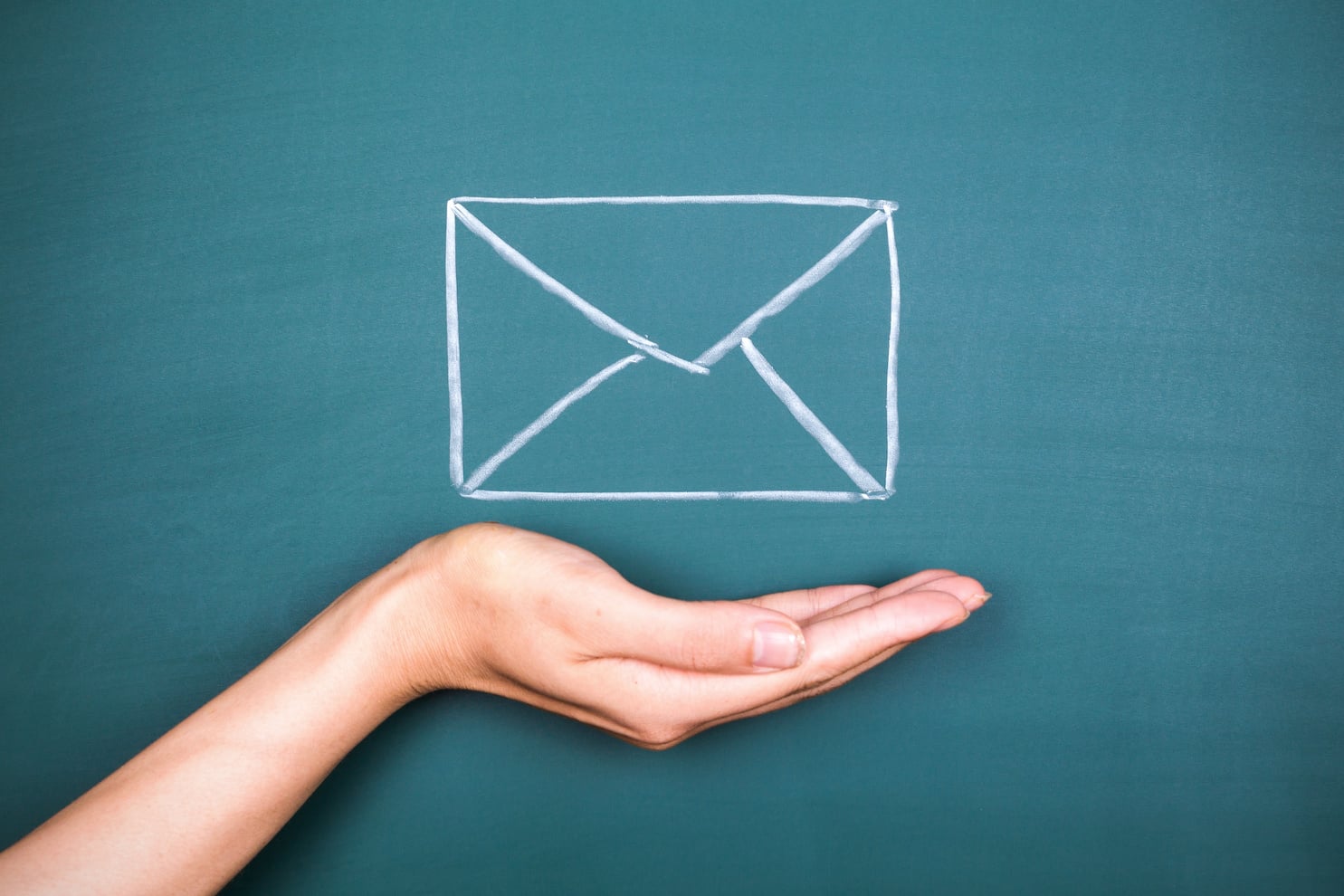 hand holding E-Mail on balckboard